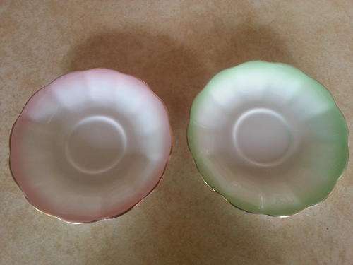Two collectable Royal Albert saucers "Rainbow series"